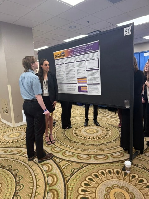 PNE Lab students presenting research at the Midwestern Psychological Association conference poster session, Chicago, April 2026