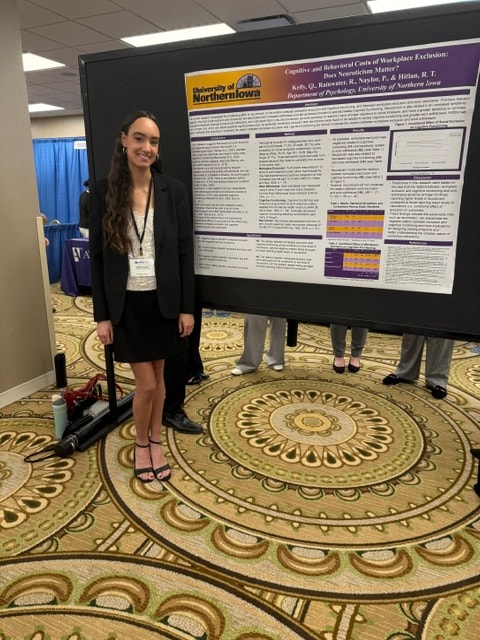 PNE Lab student presenting research poster at the Midwestern Psychological Association conference, Chicago, April 2026